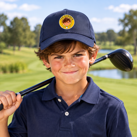 Kid wearing the Super Golfers The Bomber cap on the golf course