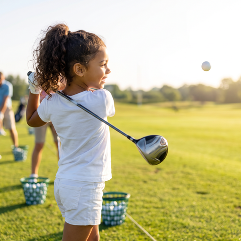 Girl swinging a golf club in the Super Golfers T-shirt