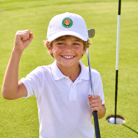 Kid celebrating a birdie in the No Name cap
