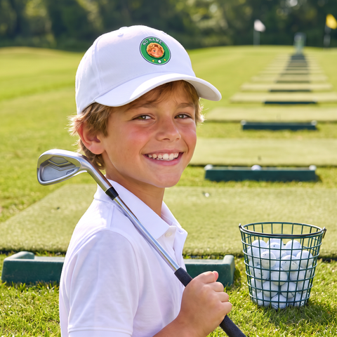 Kid at the driving range in the No Name cap