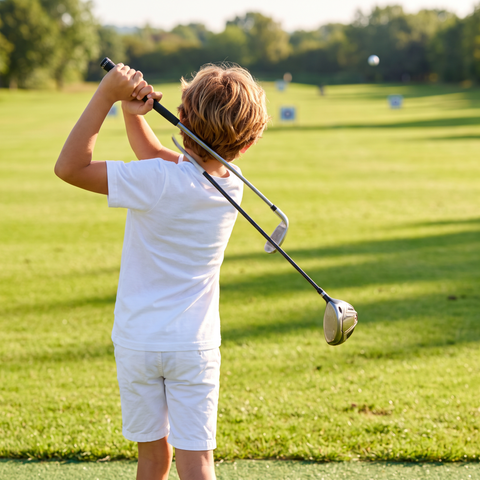 Kid swinging a golf club in the Super Golfers T-shirt